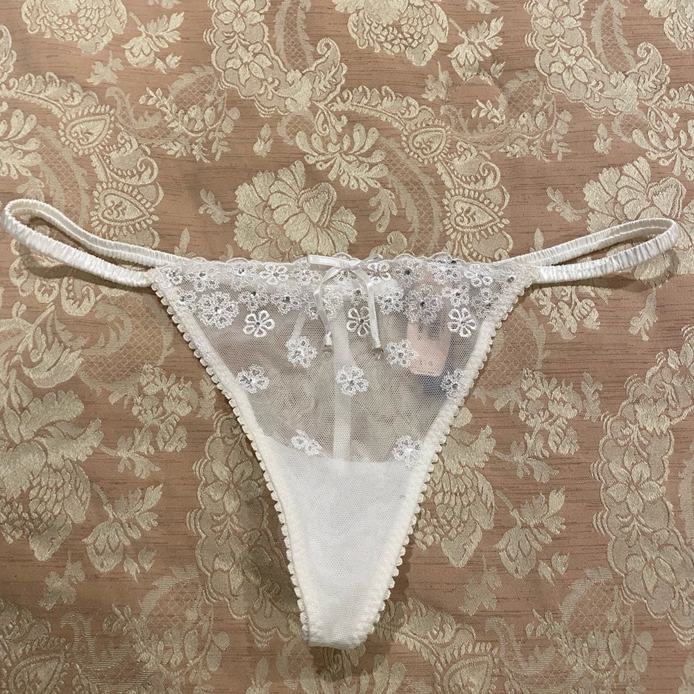 Victoria’s Secret thong with crystals in white color. NWT size L
